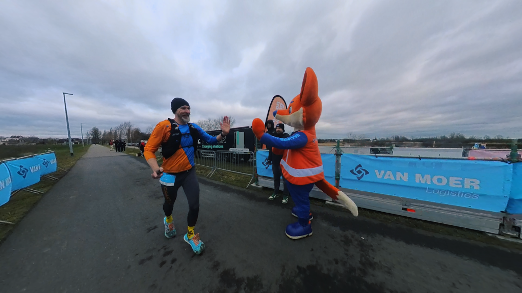 The Running Dutchman giving the mascot of The Van Moer Marathon a high five